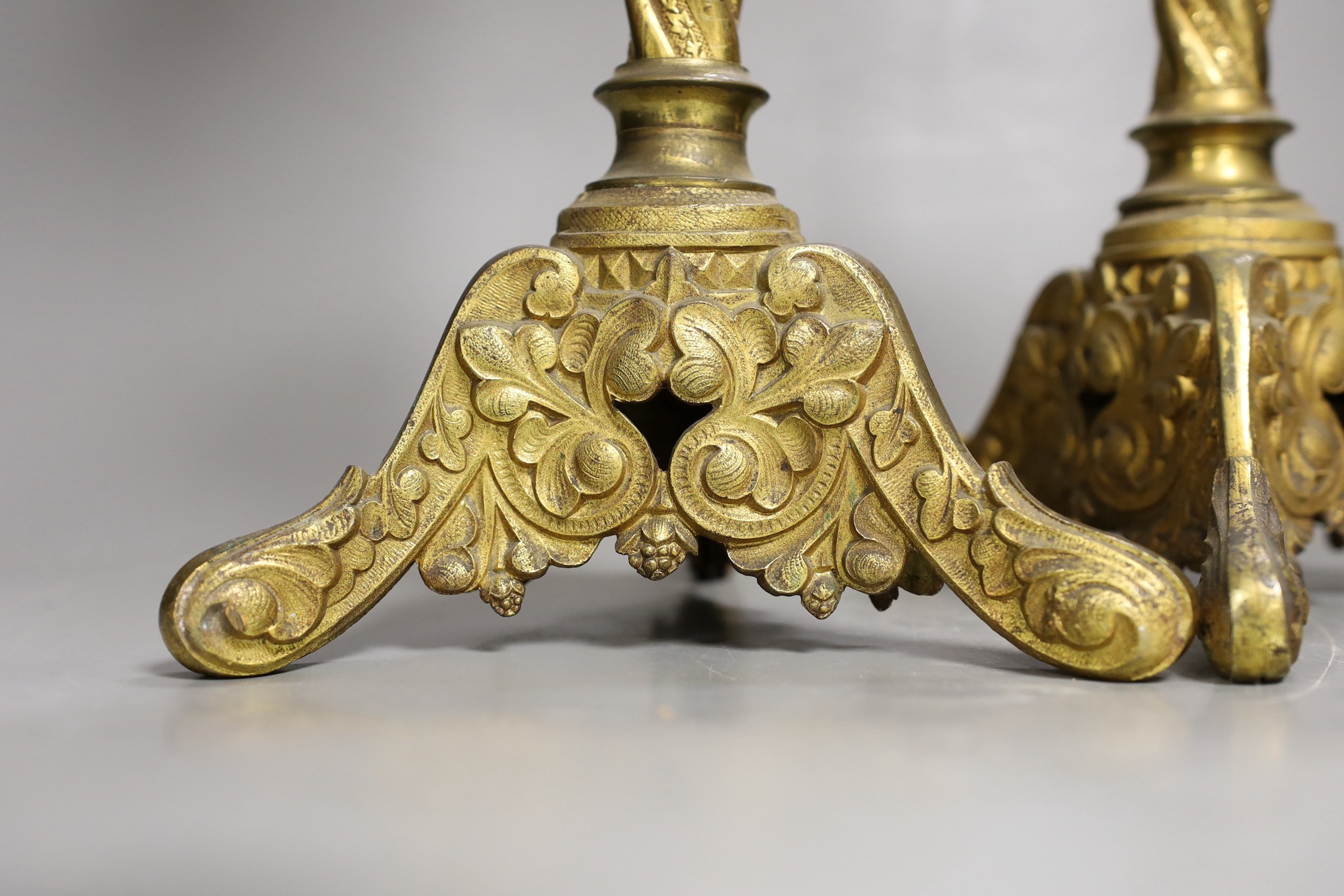 A pair of gilt brass pricket sticks, 51cms high